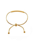 Gold bracelet on a white background