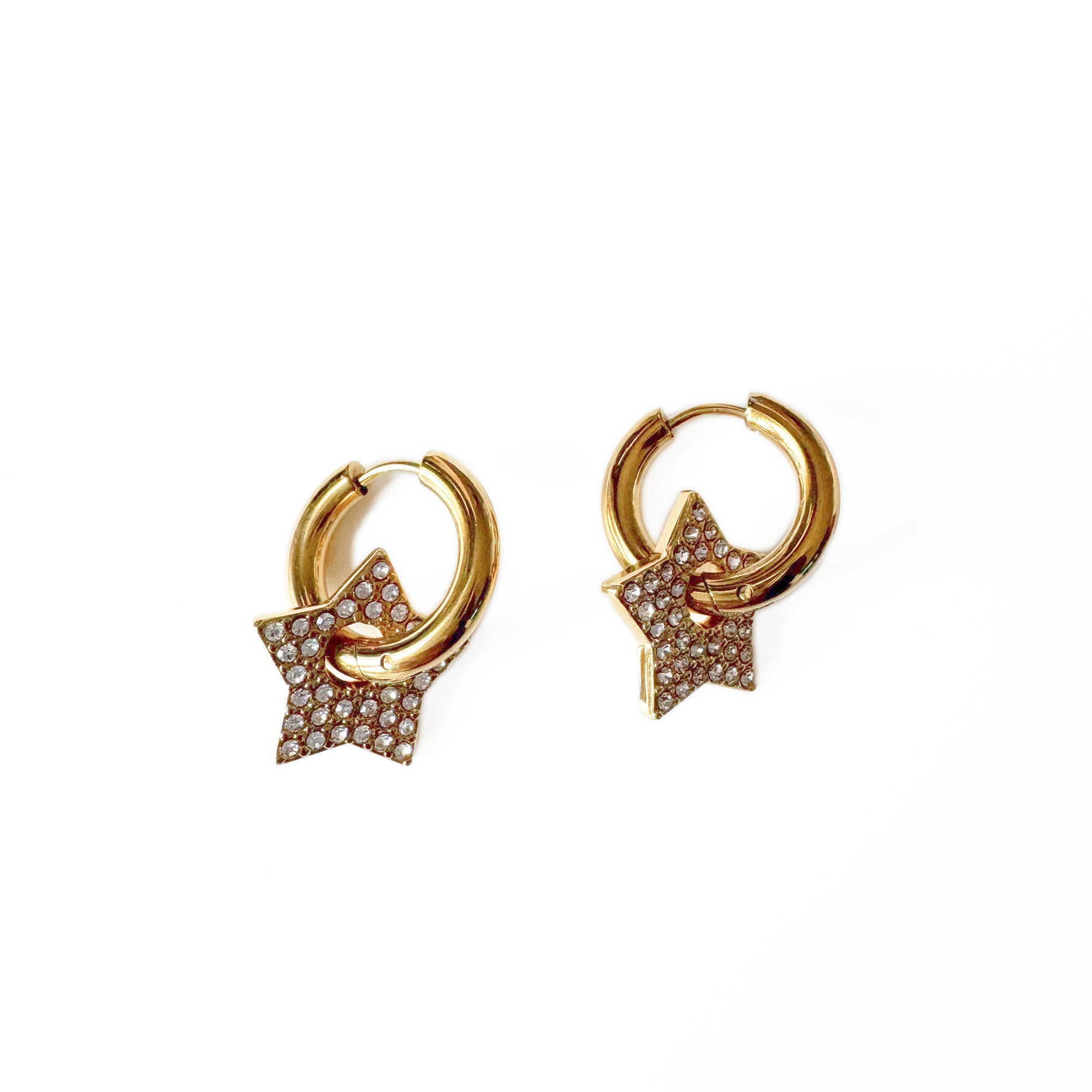 Gold hoop earrings with star-shaped pendants on a white background