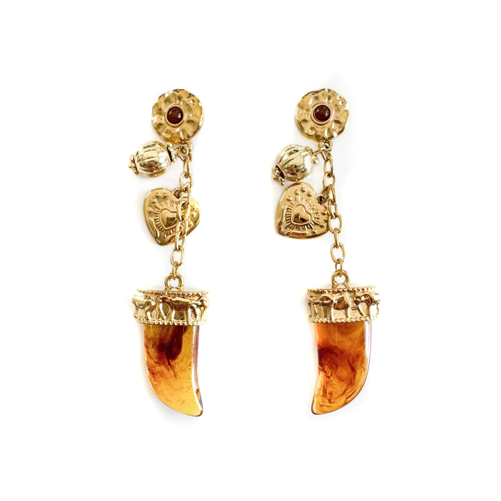 Gold earrings with amber-colored gemstones on a white background