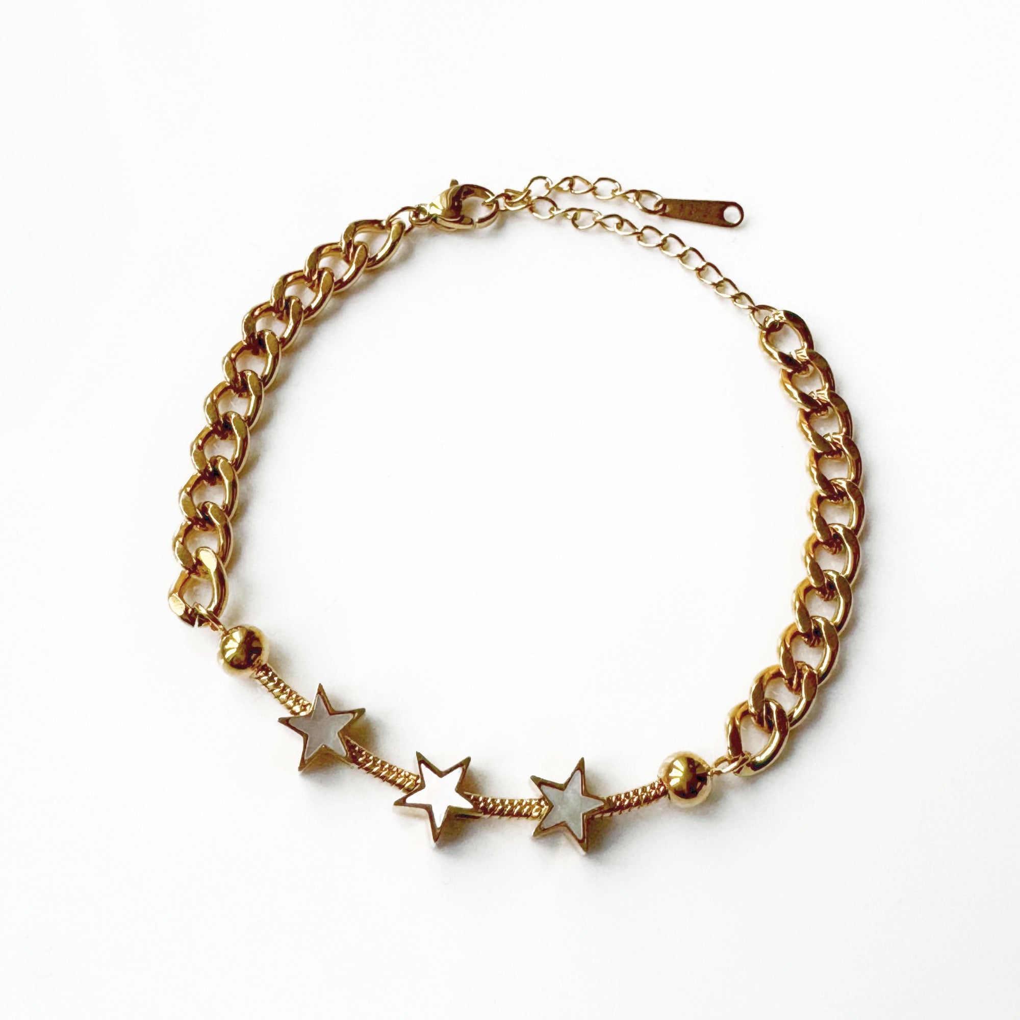 An 18k gold plated star bracelet with a chain-link design and multiple star charms, displayed against a white background.