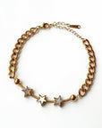 An 18k gold plated star bracelet with a chain-link design and multiple star charms, displayed against a white background.
