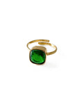 Gold ring with a green gemstone on a white background